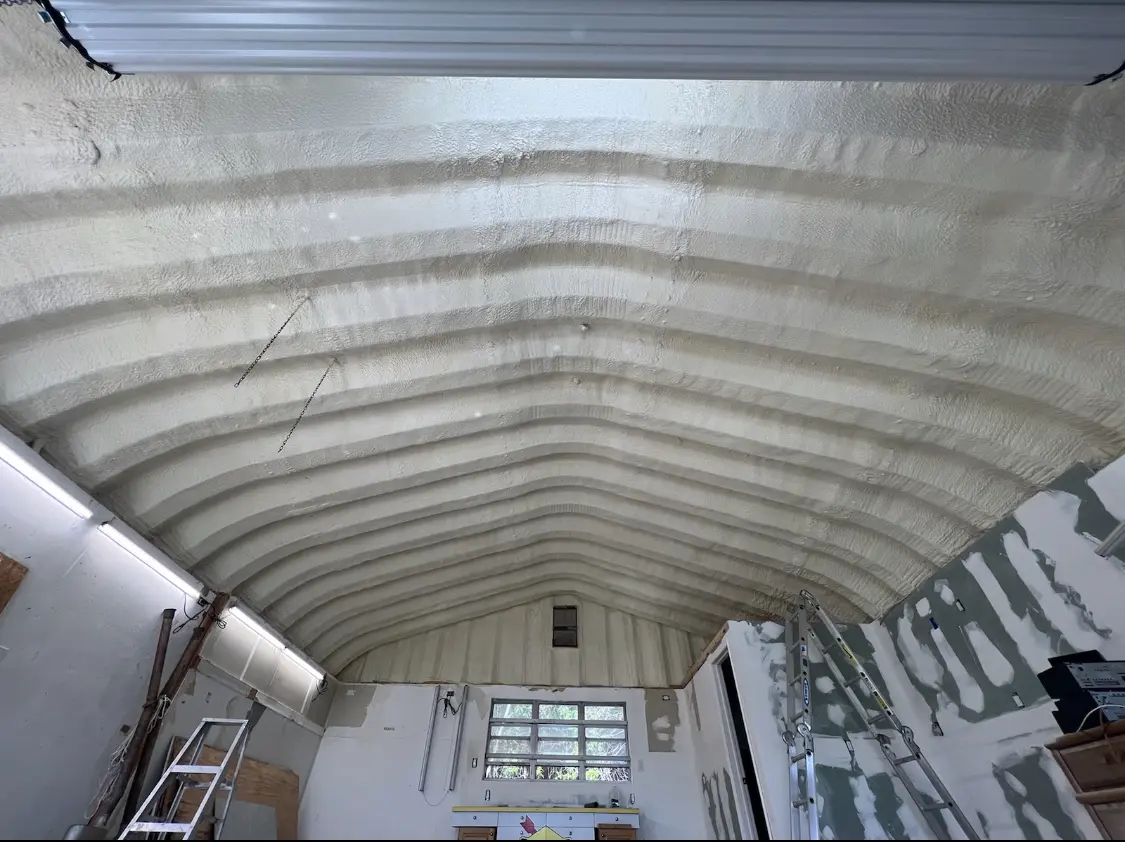 Spray polyurethane foam applied to the underside of a metal roof deck in Westbrook